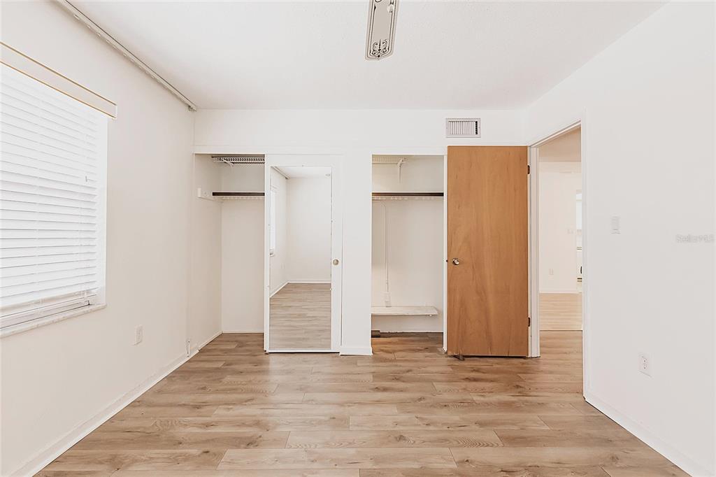 4158 Tamiami Trail, Unit S6 Port Charlotte, FL 33952 - Photo 16 of 39 a view of empty room with wooden floor