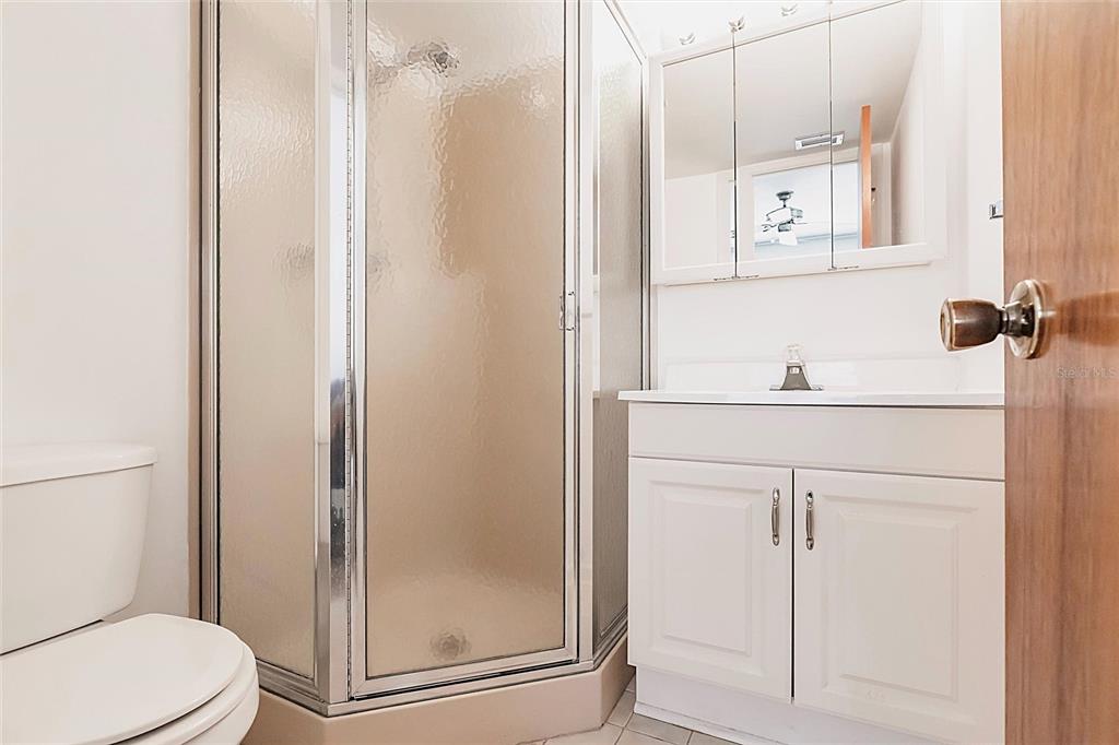 4158 Tamiami Trail, Unit S6 Port Charlotte, FL 33952 - Photo 17 of 39 a bathroom with a shower a toilet and a sink