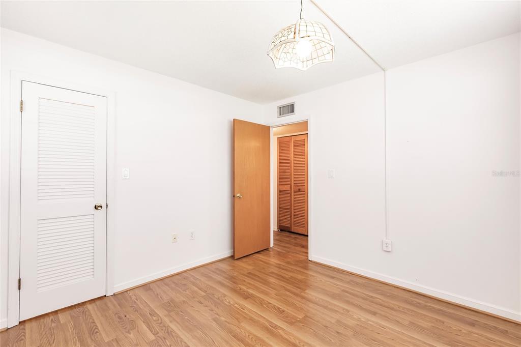 4158 Tamiami Trail, Unit S6 Port Charlotte, FL 33952 - Photo 20 of 39 a view of empty room with wooden floor