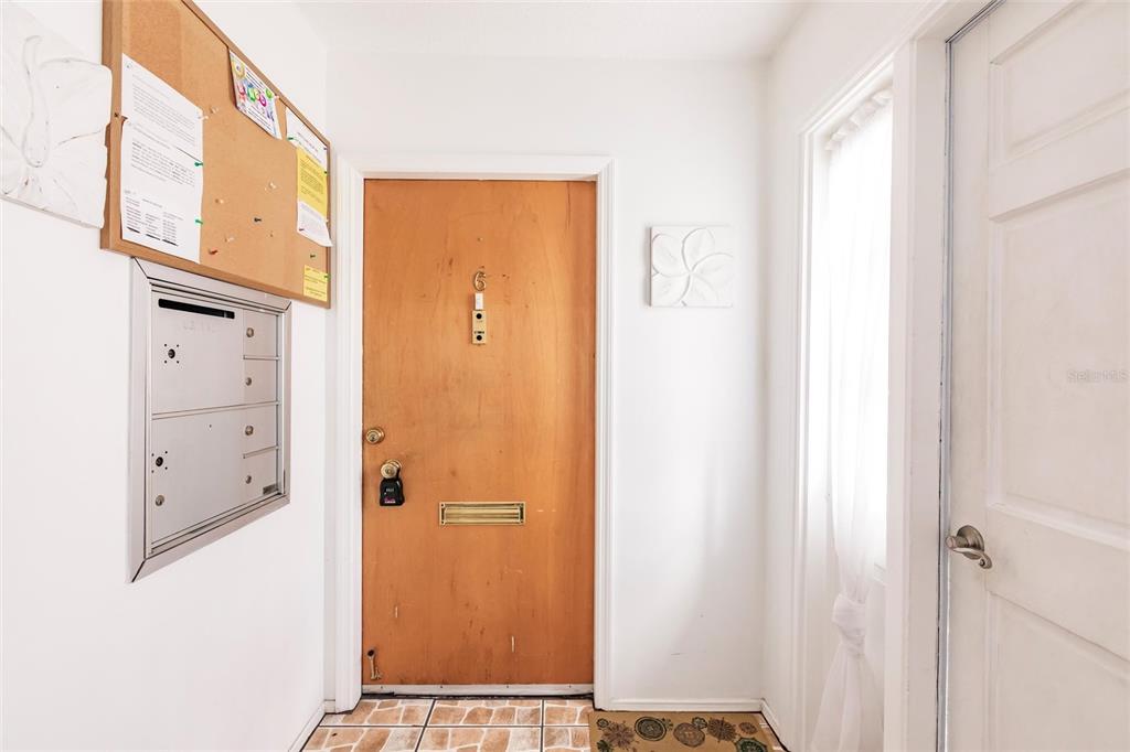 4158 Tamiami Trail, Unit S6 Port Charlotte, FL 33952 - Photo 2 of 39 a view of a hallway with elevator