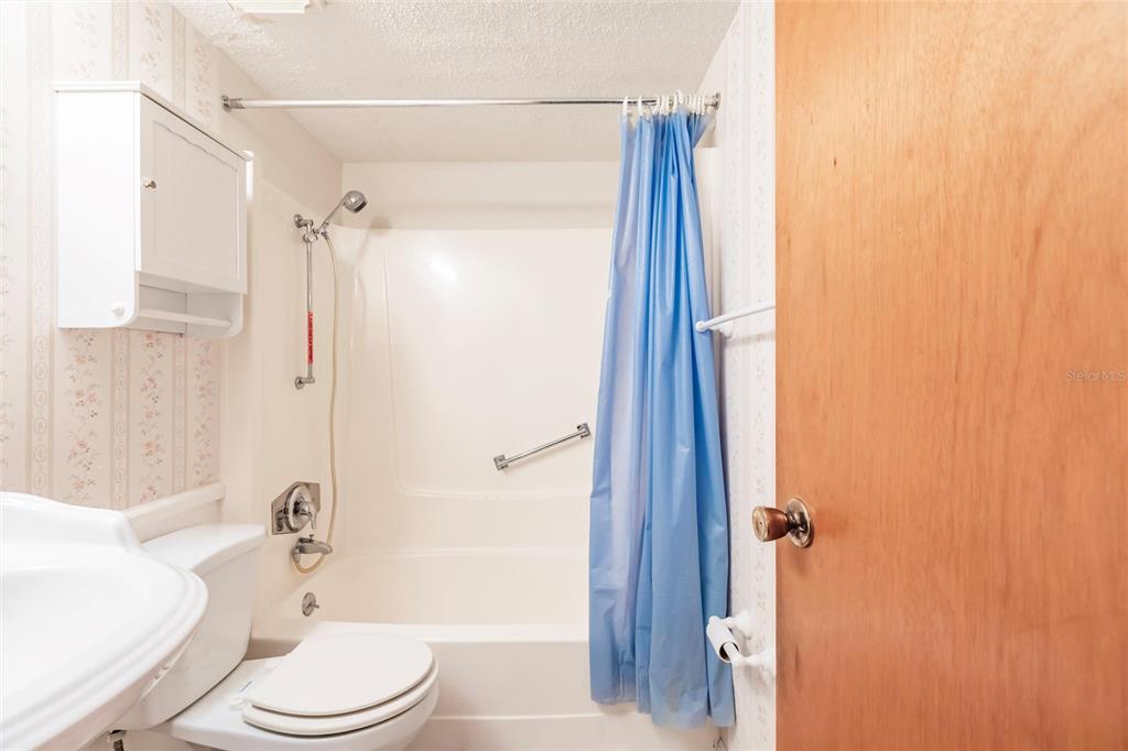 4158 Tamiami Trail, Unit S6 Port Charlotte, FL 33952 - Photo 23 of 39 a bathroom with a toilet a sink and bathtub