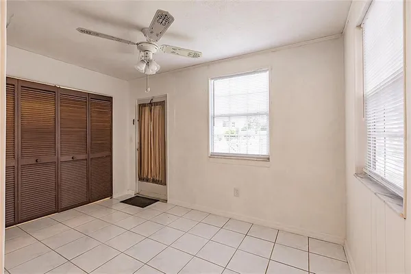 a view of an empty room with a window
