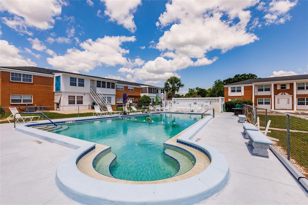 4158 Tamiami Trail, Unit S6 Port Charlotte, FL 33952 - Photo 30 of 39 a view of a house with swimming pool