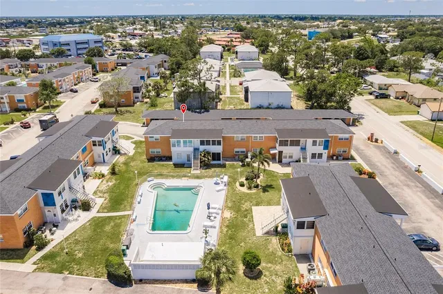an aerial view of residential houses with outdoor space