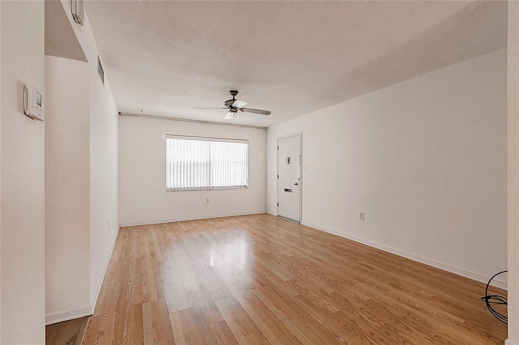 4158 Tamiami Trail, Unit S6 Port Charlotte, FL 33952 - Photo 5 of 39 wooden floor in an empty room