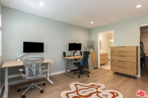 a view of a workspace with furniture