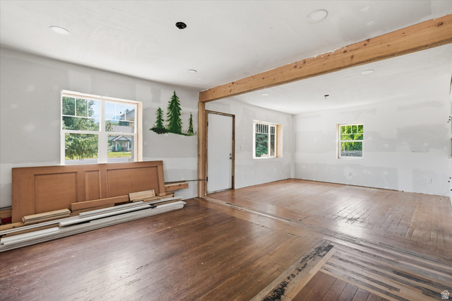 395 North 400 West Logan, UT 84321 - Photo 3 of 48 Expansive room featuring wood-finish flooring, exposed wood beam, multiple windows, and recessed lighting