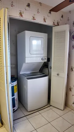 a front view of a building with balcony and staircase