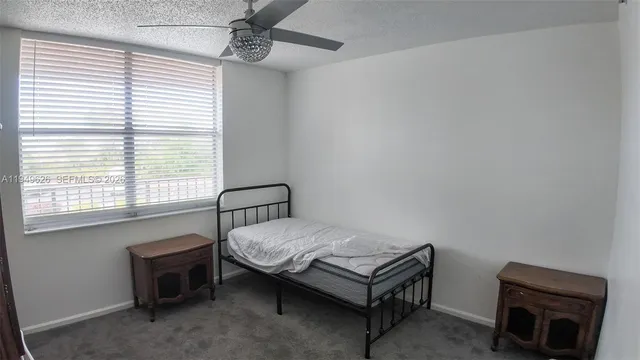 a room with a bed and a window