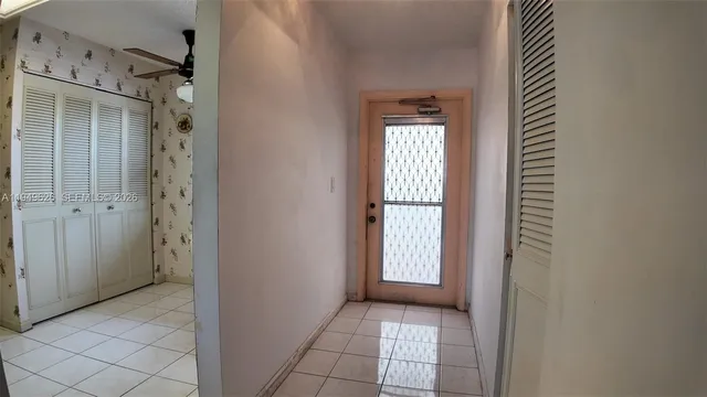 a kitchen with stainless steel appliances a refrigerator sink and cabinets