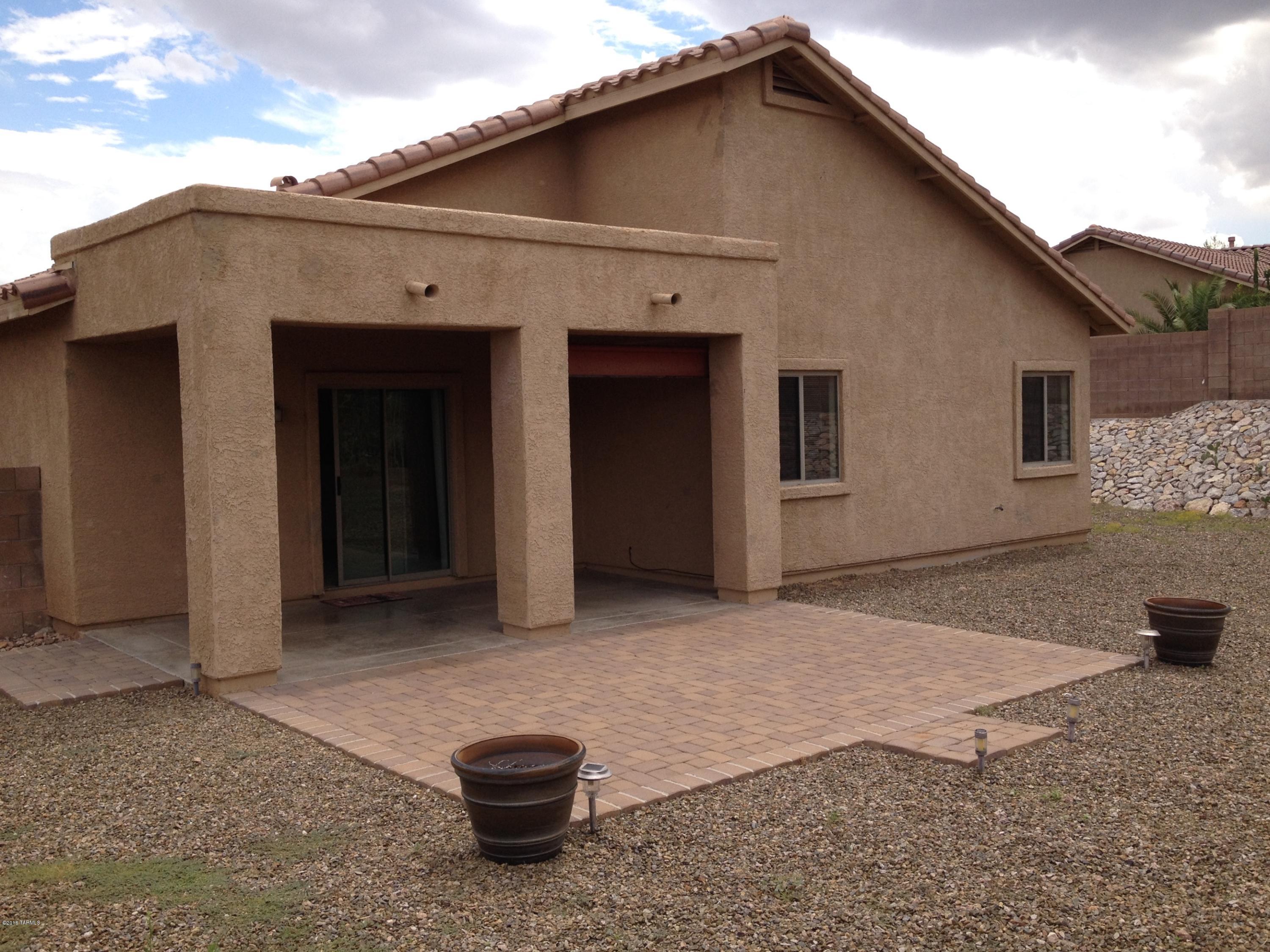 7931 North Iron Ridge Drive Tucson, AZ 85743 - Photo 18 of 21 a backyard of a house