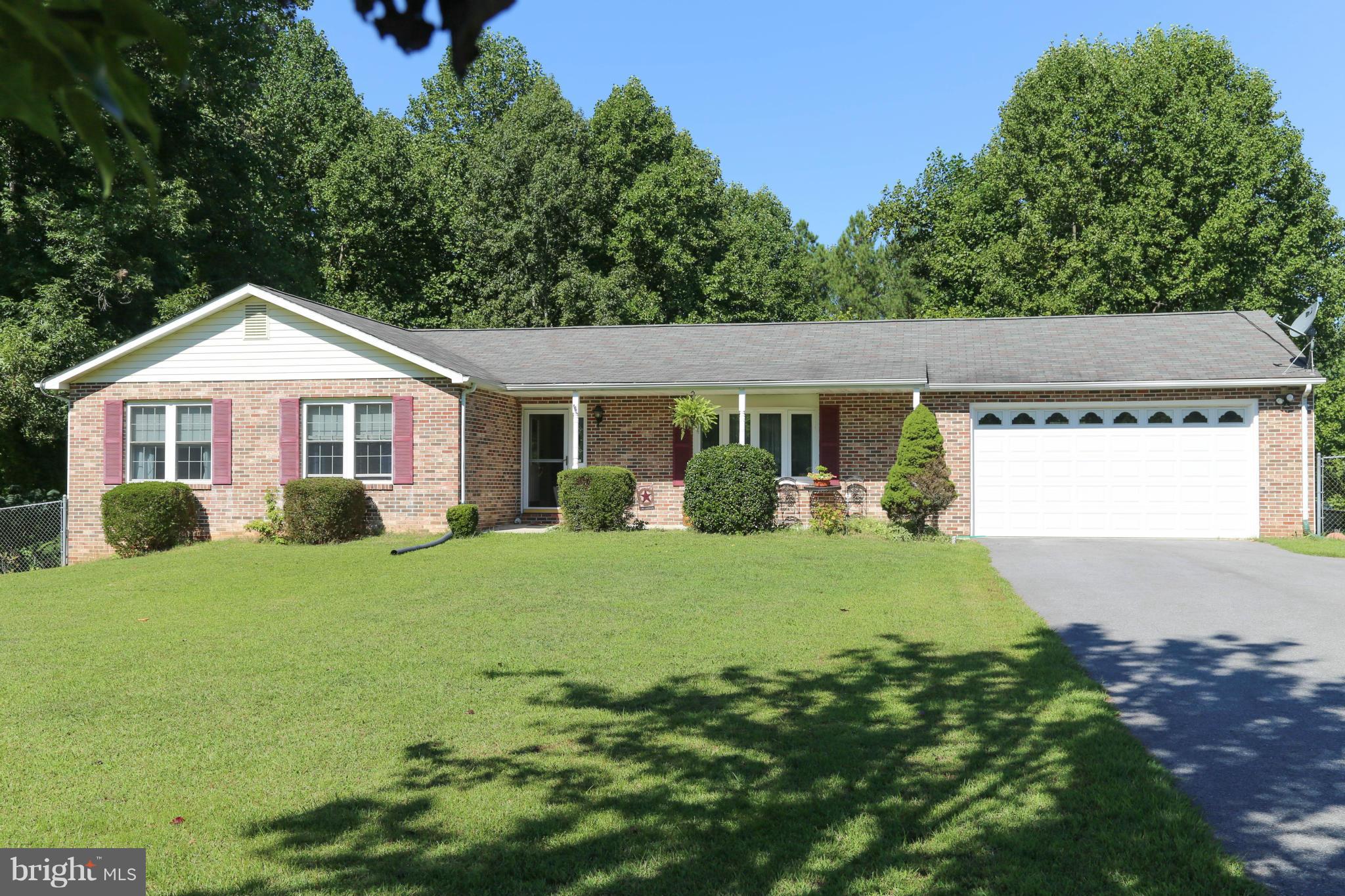 1190 Plum Point Road Huntingtown, MD 20639 - Photo 1 of 20 a front view of a house with a yard