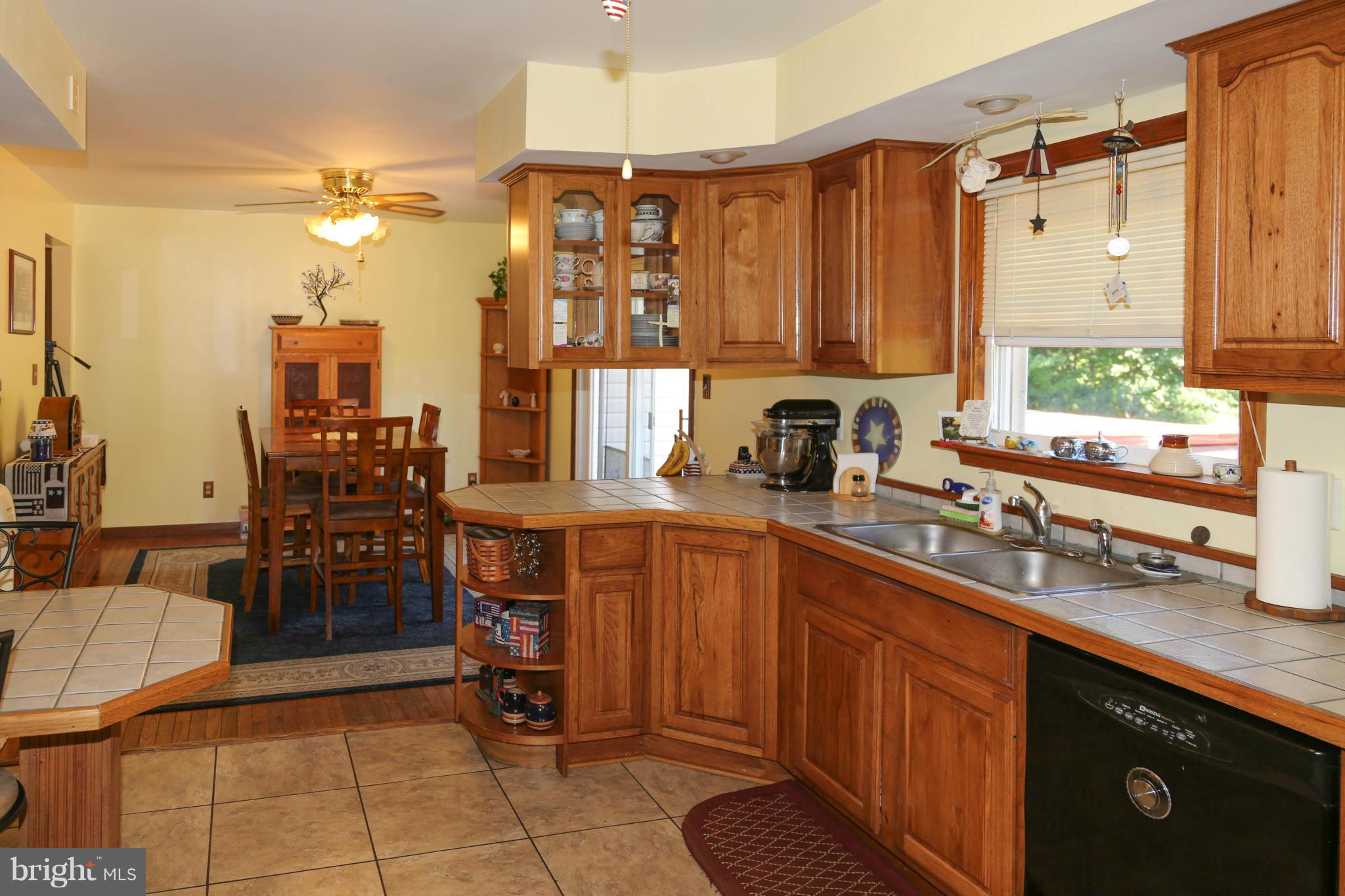 1190 Plum Point Road Huntingtown, MD 20639 - Photo 9 of 20 a kitchen with a sink and cabinets