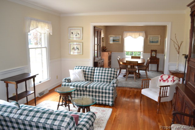 10306 Buckley Hall Road Mathews, VA 23109 - Photo 8 of 22 a living room with furniture and a window