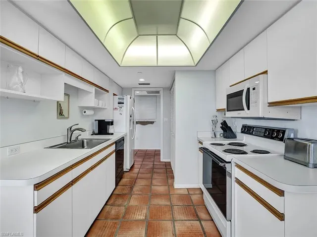 a kitchen with a stove and a sink