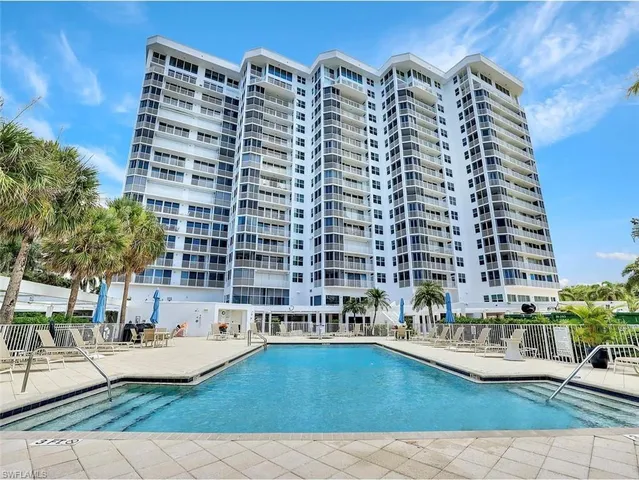 a view of building with outdoor space and swimming pool