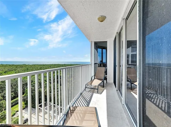 a view of balcony with wooden floor