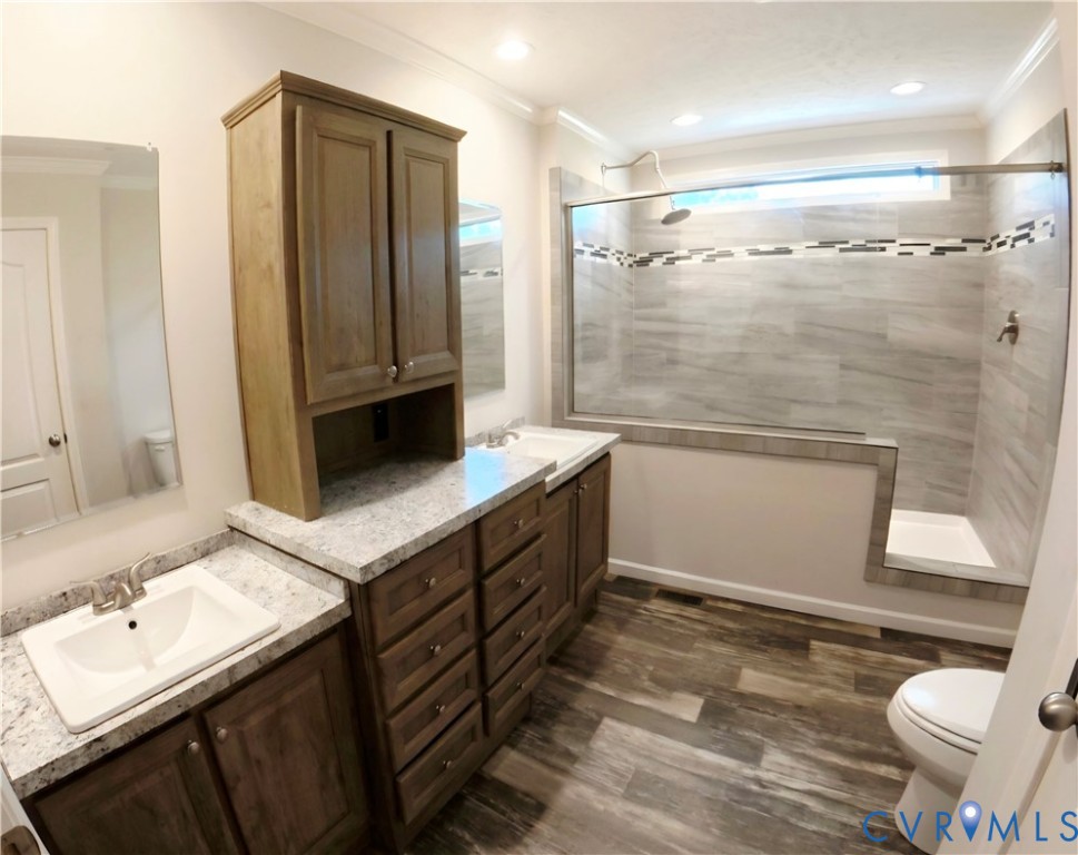 601 Middle Fork Road Palmyra, VA 22963 - Photo 12 of 22 a bathroom with a double vanity sink toilet and shower