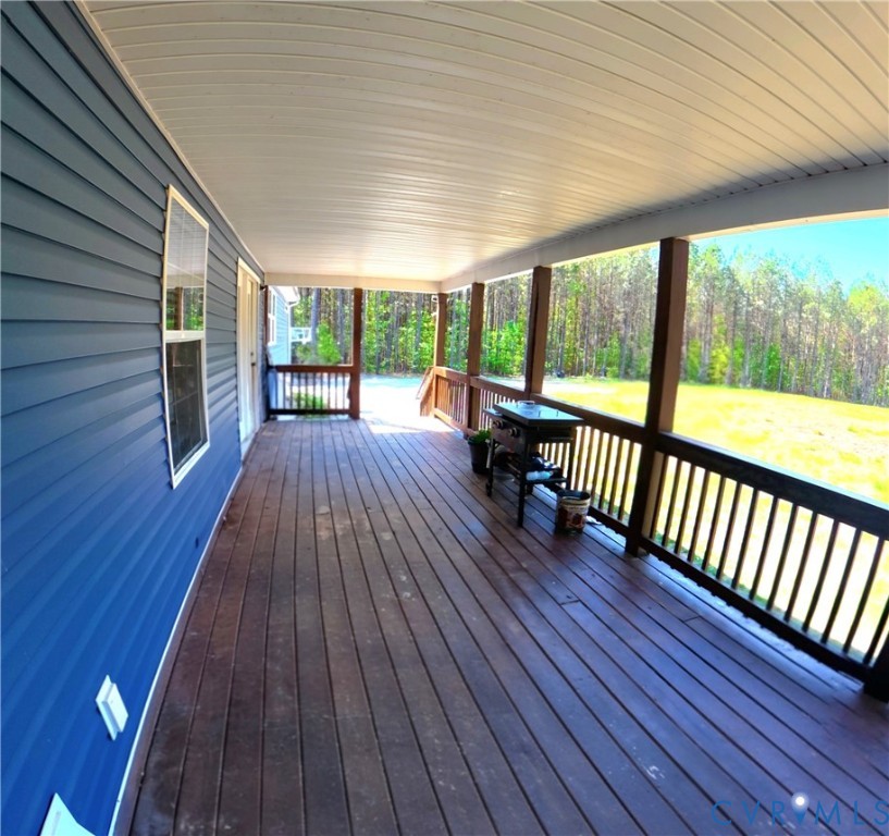 601 Middle Fork Road Palmyra, VA 22963 - Photo 19 of 22 a view of backyard with a deck and wooden floor