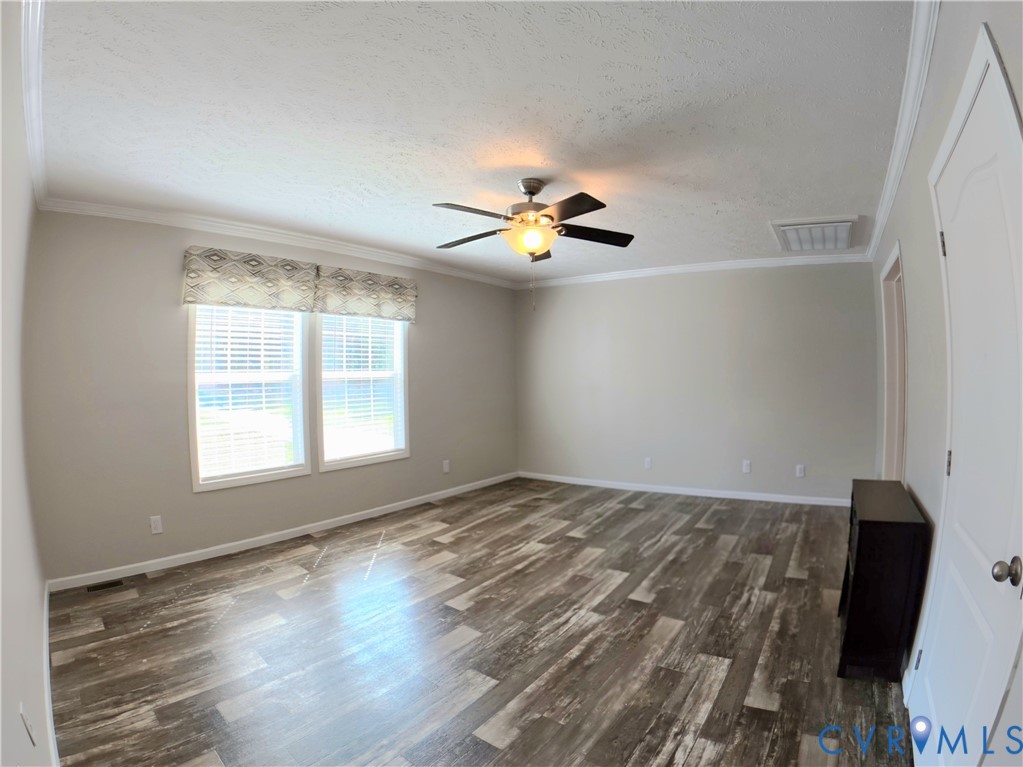 601 Middle Fork Road Palmyra, VA 22963 - Photo 10 of 22 a view of empty room with wooden floor and fan
