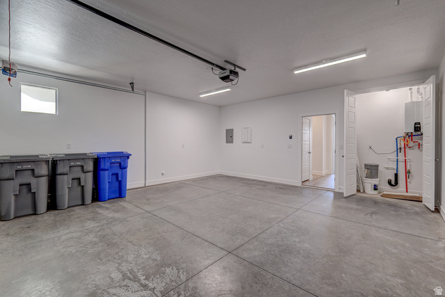2072 W. 320 S. Hurricane, UT 84737 - Photo 33 of 46 2 Car Finished Garage with tankless water heater, electric panel, and a garage door opener