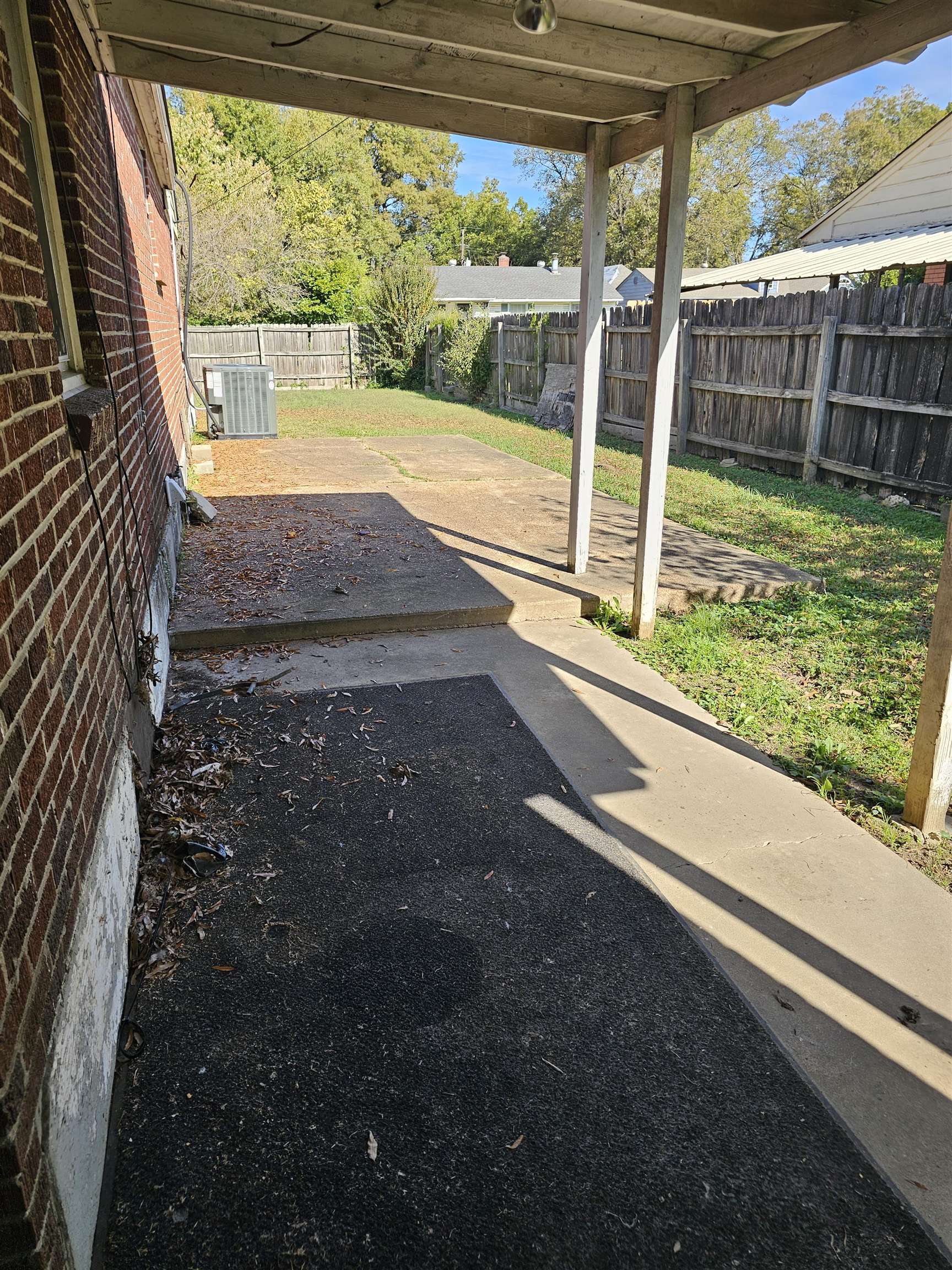 1196 Wells Station Road Memphis, TN 38122 - Photo 7 of 20 Fenced backyard with a patio area