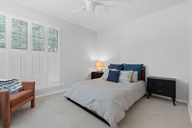 a bedroom with a bed and a couch