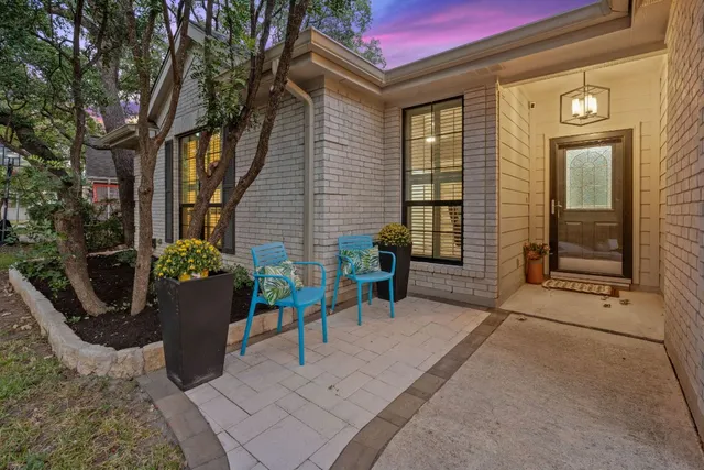 a view of a chair and table in the patio