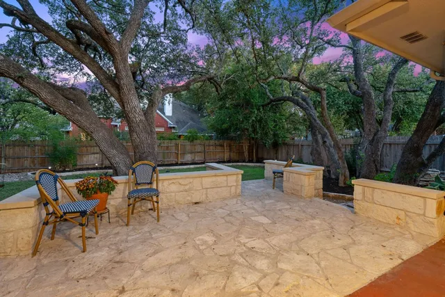 a view of a backyard with sitting area