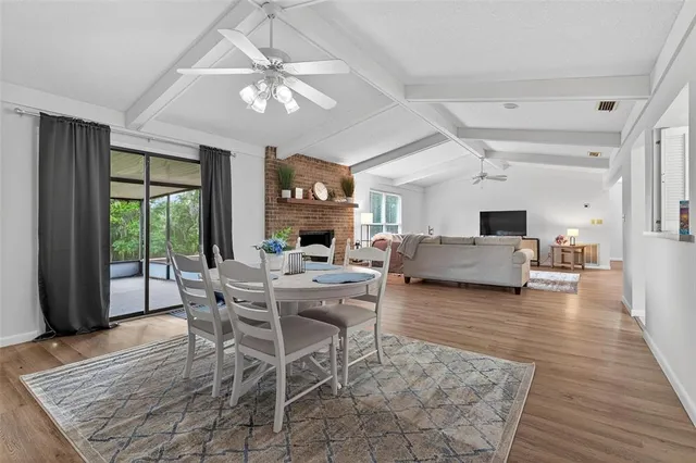 a view of a dining room with furniture window and wooden floor
