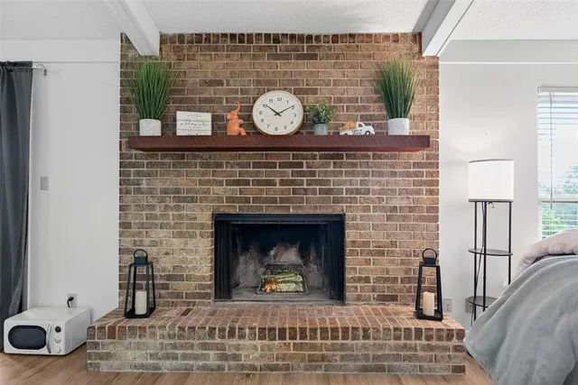 a fireplace with a clock on the wall