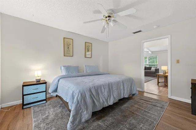 a bed room with a bed and a window