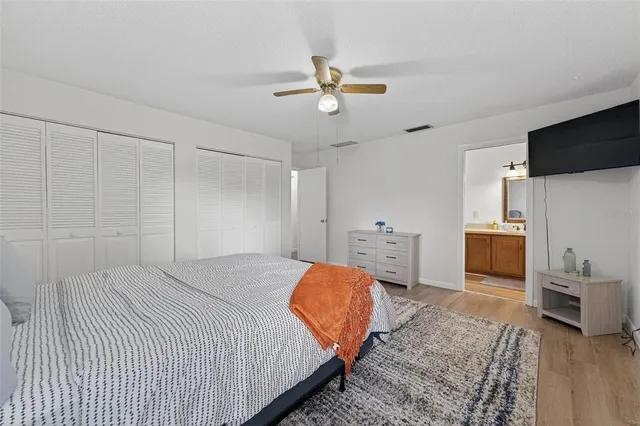 a bathroom with a sink vanity and a mirror