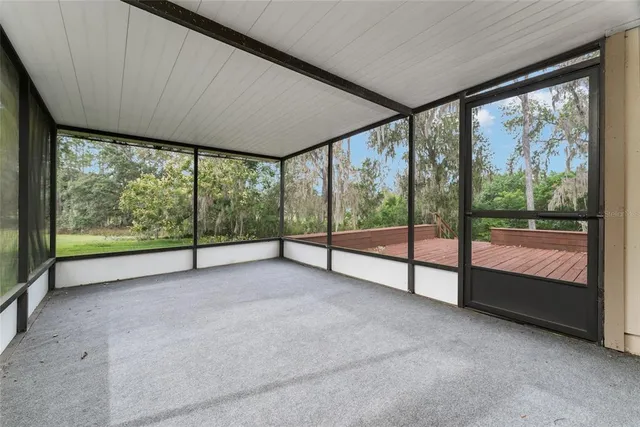 a view of an outdoor space with deck and a garden