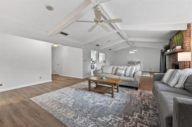 a living room with furniture and a rug