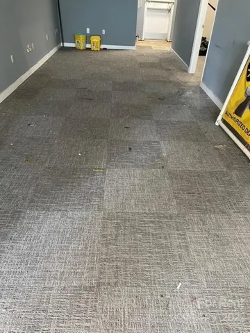 a view of storage and utility room with closet