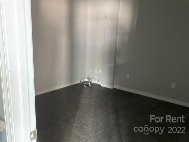 3390 South New Hope Road Gastonia, NC 28056 - Photo 8 of 26 a view of an empty room with wooden floor