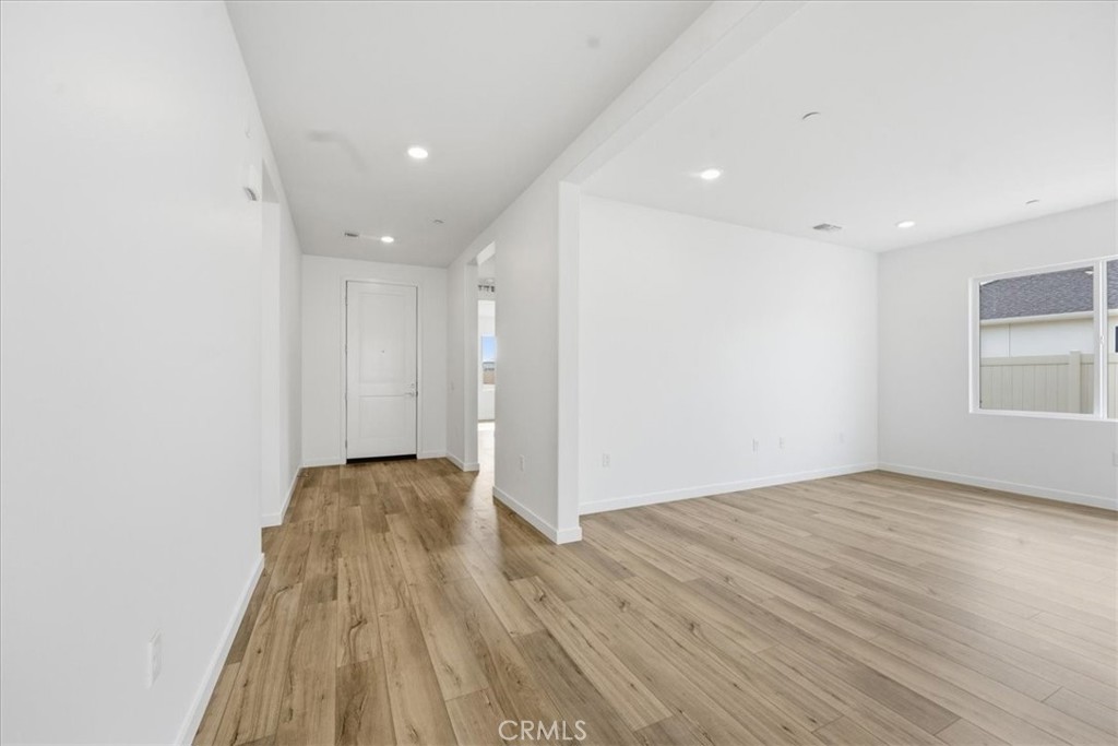 42957 56th Street West Lancaster, CA 93536 - Photo 15 of 40 a view of empty room with wooden floor