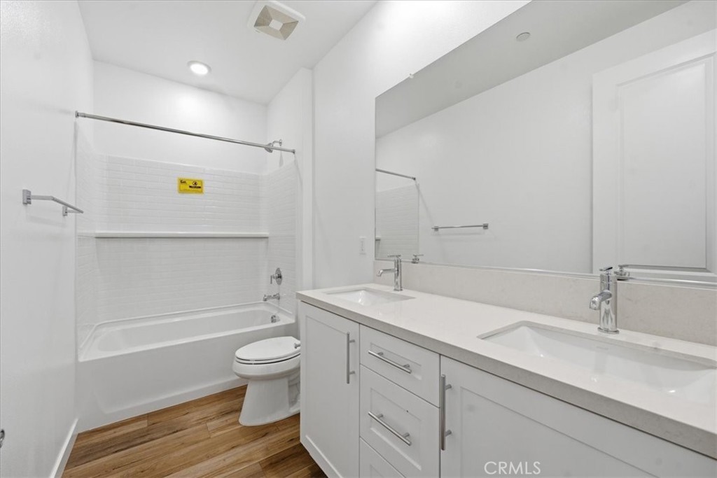 42957 56th Street West Lancaster, CA 93536 - Photo 26 of 40 a bathroom with a sink a toilet and shower