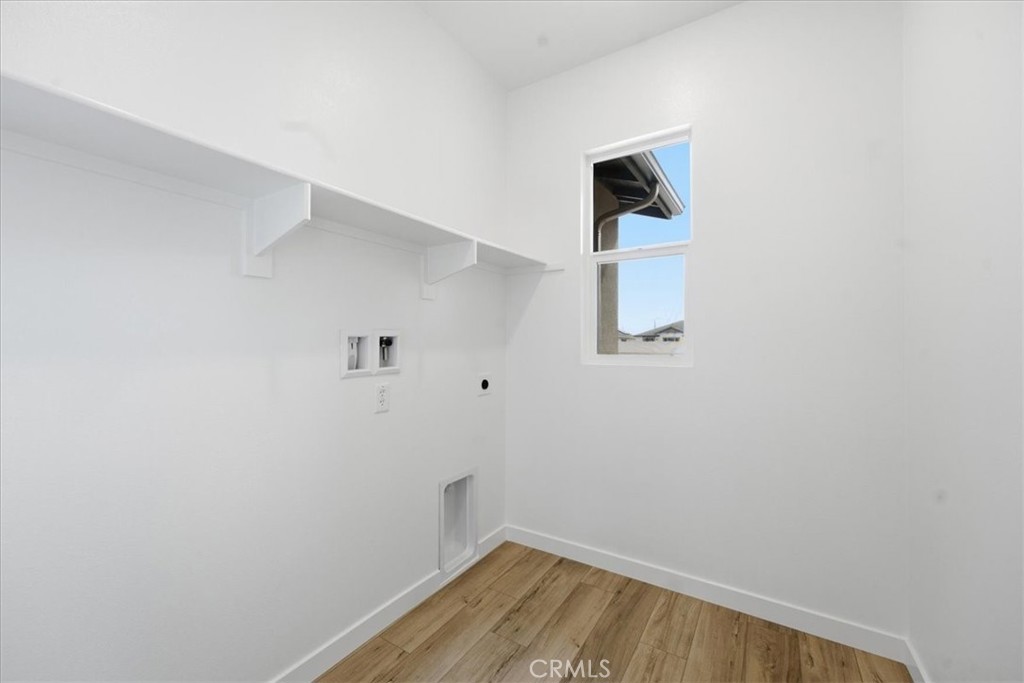 42957 56th Street West Lancaster, CA 93536 - Photo 29 of 40 a room with a window and wooden floor