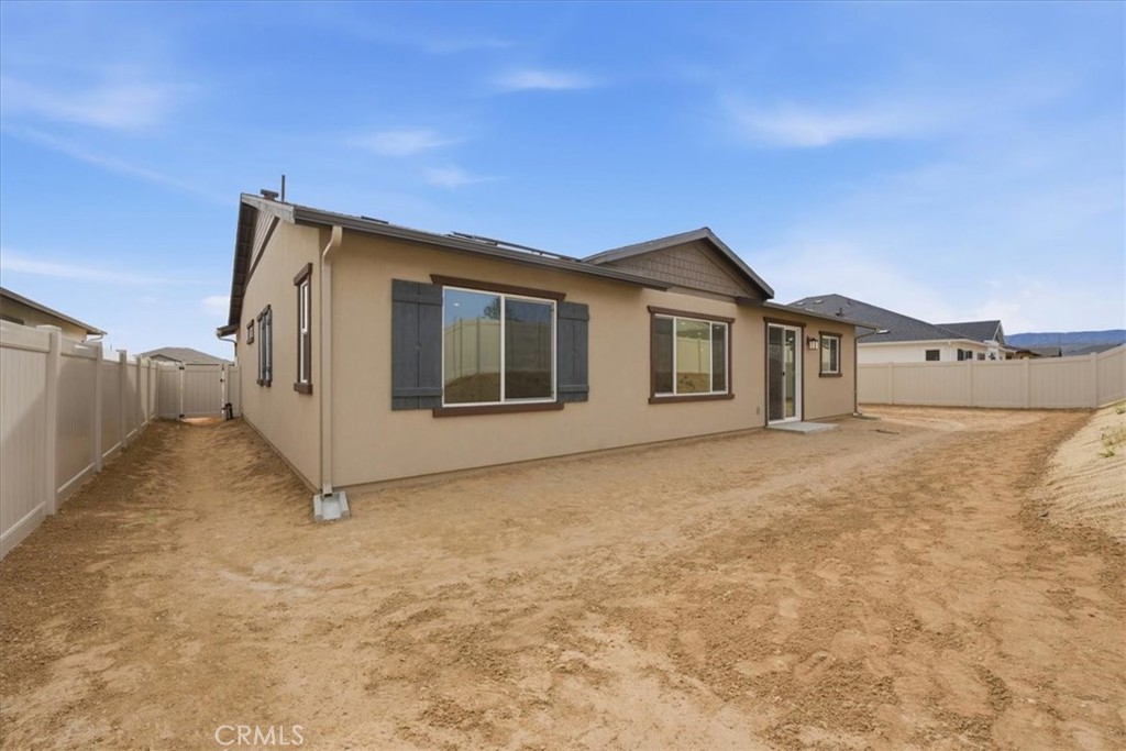 42957 56th Street West Lancaster, CA 93536 - Photo 31 of 40 a view of a house with a wooden fence