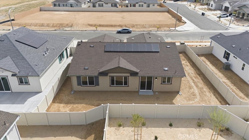 42957 56th Street West Lancaster, CA 93536 - Photo 32 of 40 a view of a building with a big yard and large windows