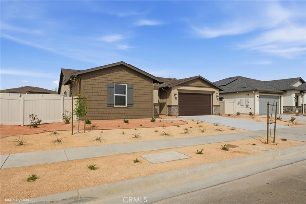 42957 56th Street West Lancaster, CA 93536 - Photo 4 of 40 a view of a house with a sink and wooden fence