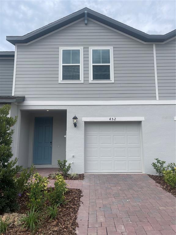 452 Legacy Loop Davenport, FL 33896 - Photo 1 of 29 a front view of a house
