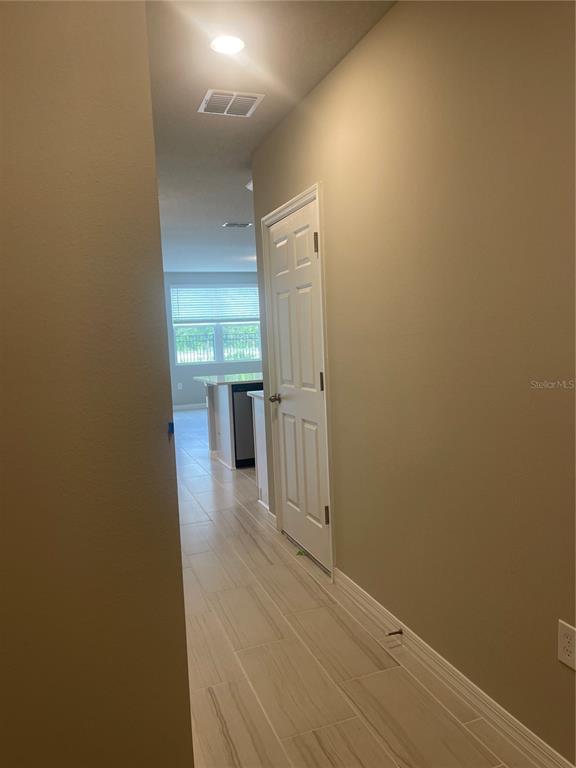 452 Legacy Loop Davenport, FL 33896 - Photo 4 of 29 a view of a hallway