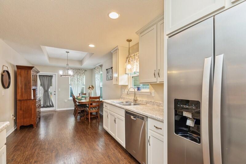 3152 Vaccari Court Crestview, FL 32539 - Photo 16 of 36 a kitchen with stainless steel appliances granite countertop a refrigerator and a view of living room