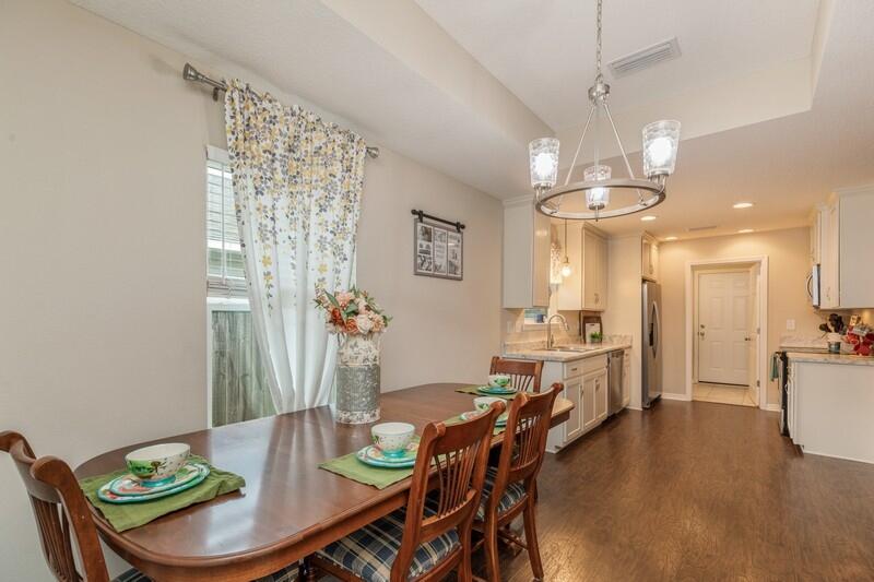 3152 Vaccari Court Crestview, FL 32539 - Photo 17 of 36 a view of a dining room with furniture window and wooden floor