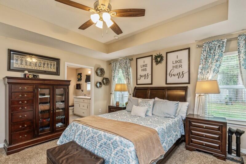 3152 Vaccari Court Crestview, FL 32539 - Photo 19 of 36 a bedroom with a bed cabinets and window