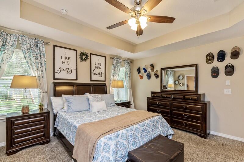 3152 Vaccari Court Crestview, FL 32539 - Photo 20 of 36 a bedroom with a bed and wooden floor