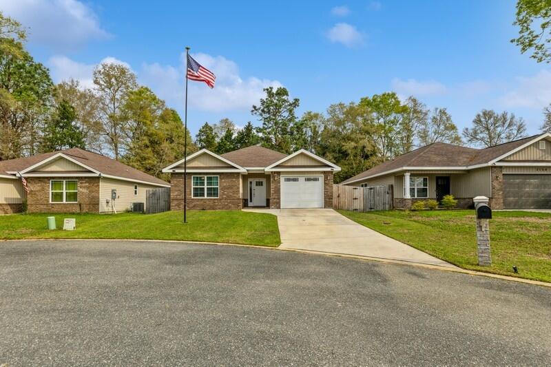 3152 Vaccari Court Crestview, FL 32539 - Photo 2 of 36 a front view of house with yard and green space